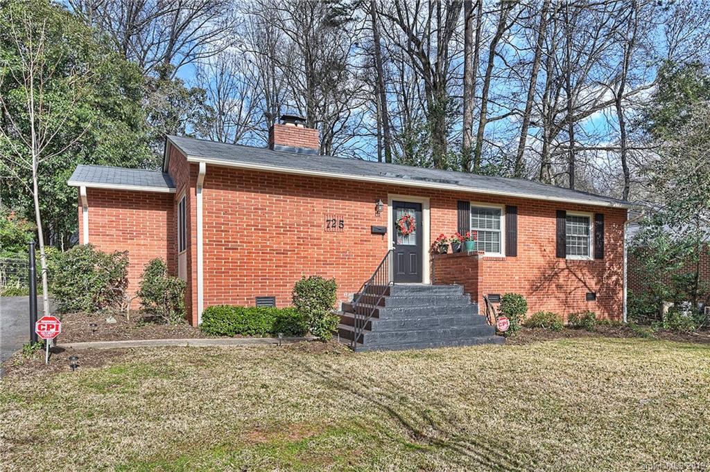 725 Lochridge Road Charlotte, NC 28209 - Photo 1 of 25 a front view of a house with garden