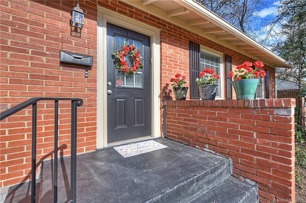 725 Lochridge Road Charlotte, NC 28209 - Photo 2 of 25 a view of a brick house with many windows
