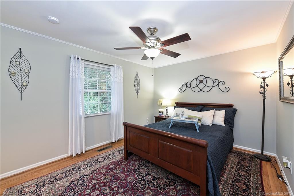 725 Lochridge Road Charlotte, NC 28209 - Photo 16 of 25 a bed room with a bed and a window