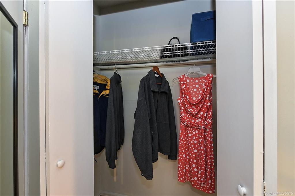 725 Lochridge Road Charlotte, NC 28209 - Photo 18 of 25 a view of walk in closet with clothes