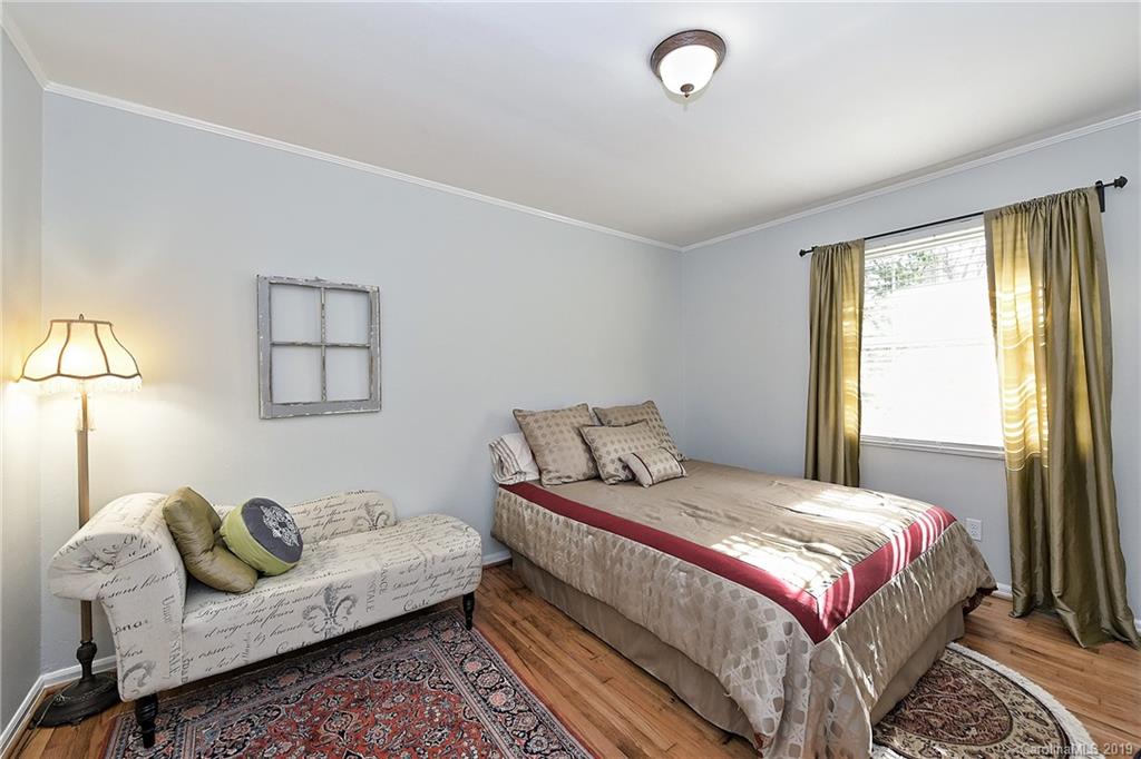 725 Lochridge Road Charlotte, NC 28209 - Photo 20 of 25 a bedroom with a bed couch and window