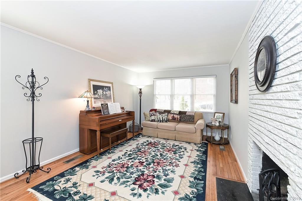 725 Lochridge Road Charlotte, NC 28209 - Photo 3 of 25 a living room with furniture and a rug