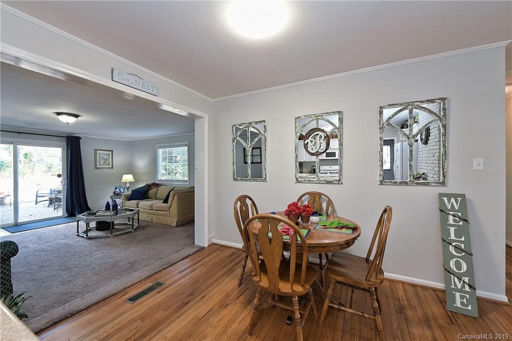 725 Lochridge Road Charlotte, NC 28209 - Photo 7 of 25 a view of a dining room with furniture window and wooden floor