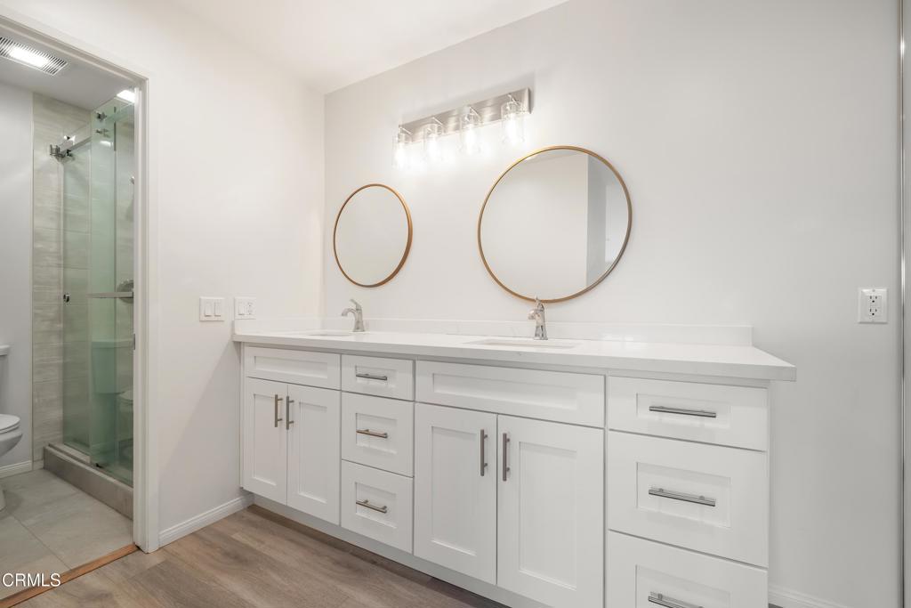 2915 Hopeton Road La Crescenta, CA 91214 - Photo 15 of 41 a bathroom with a double vanity sink and a mirror