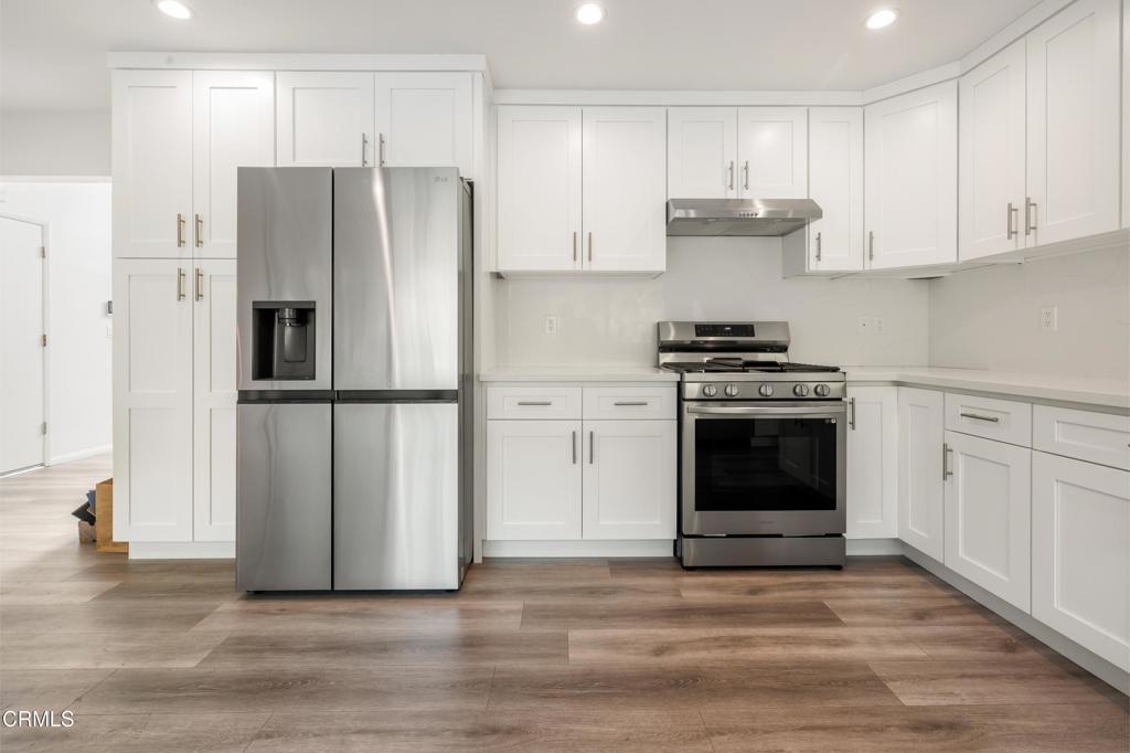 2915 Hopeton Road La Crescenta, CA 91214 - Photo 19 of 41 a kitchen with a stove top oven and refrigerator