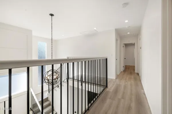a view of a hallway with a window