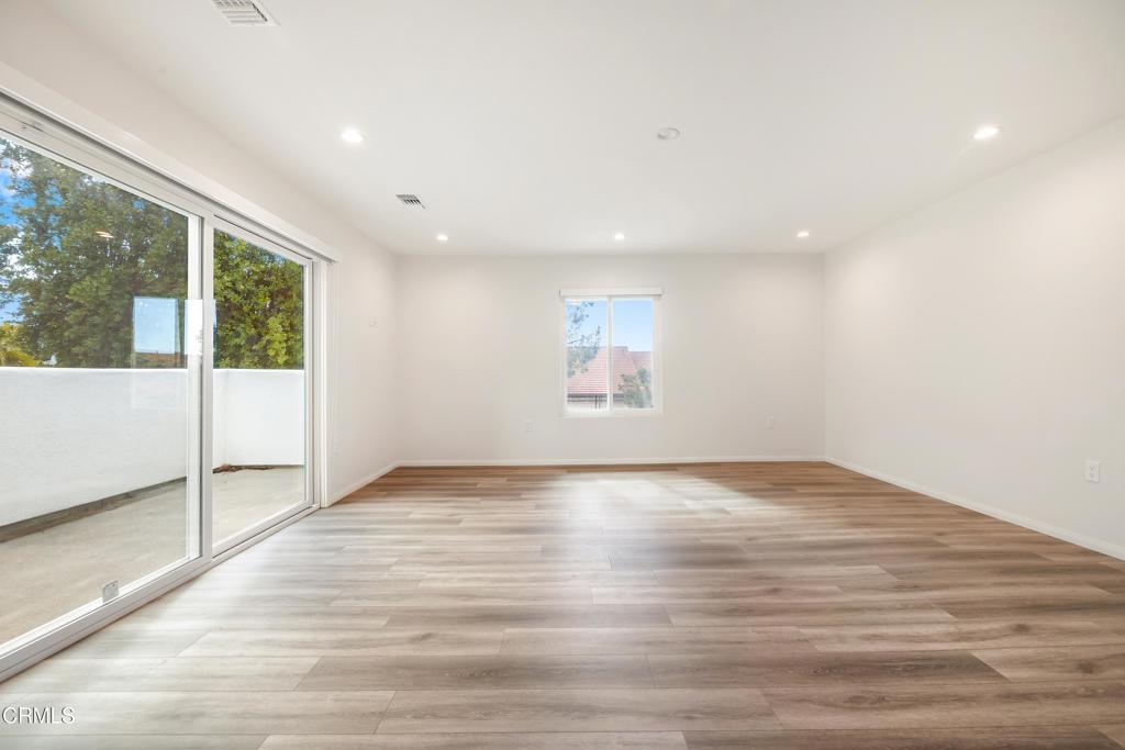 2915 Hopeton Road La Crescenta, CA 91214 - Photo 26 of 41 a view of an empty room with wooden floor and a window