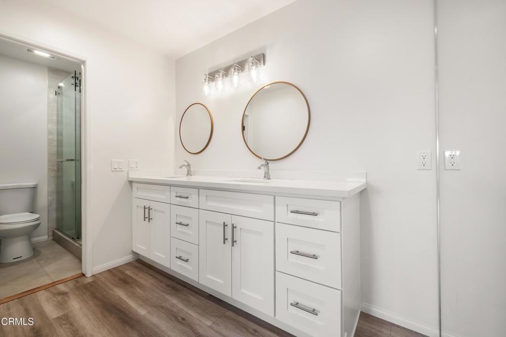 2915 Hopeton Road La Crescenta, CA 91214 - Photo 29 of 41 a bathroom with a toilet sink and mirror