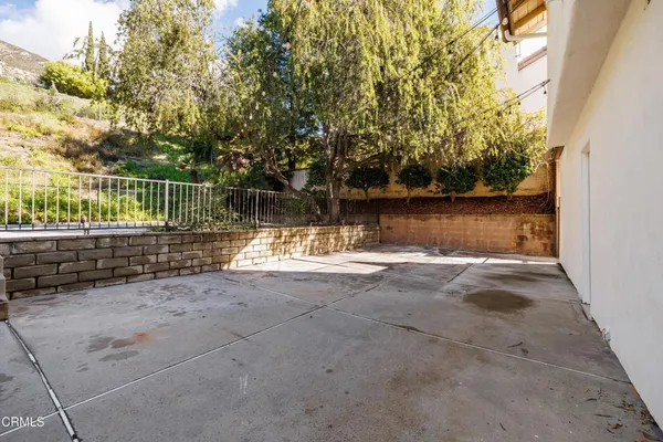 a view of a back yard of the house