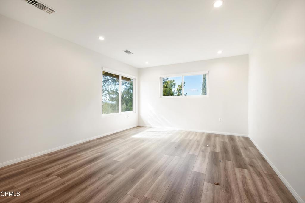 2915 Hopeton Road La Crescenta, CA 91214 - Photo 31 of 41 an empty room with wooden floor and windows