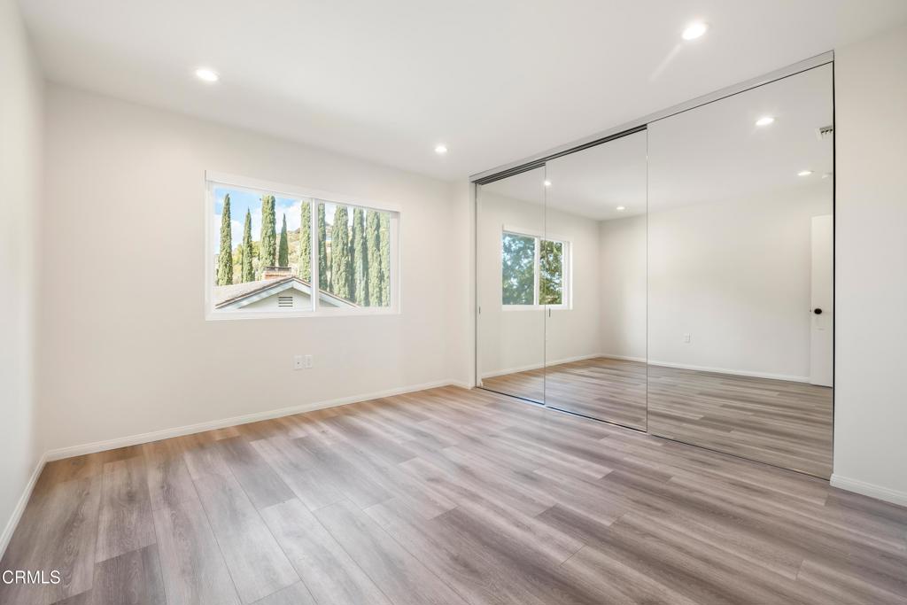 2915 Hopeton Road La Crescenta, CA 91214 - Photo 33 of 41 an empty room with wooden floor and windows