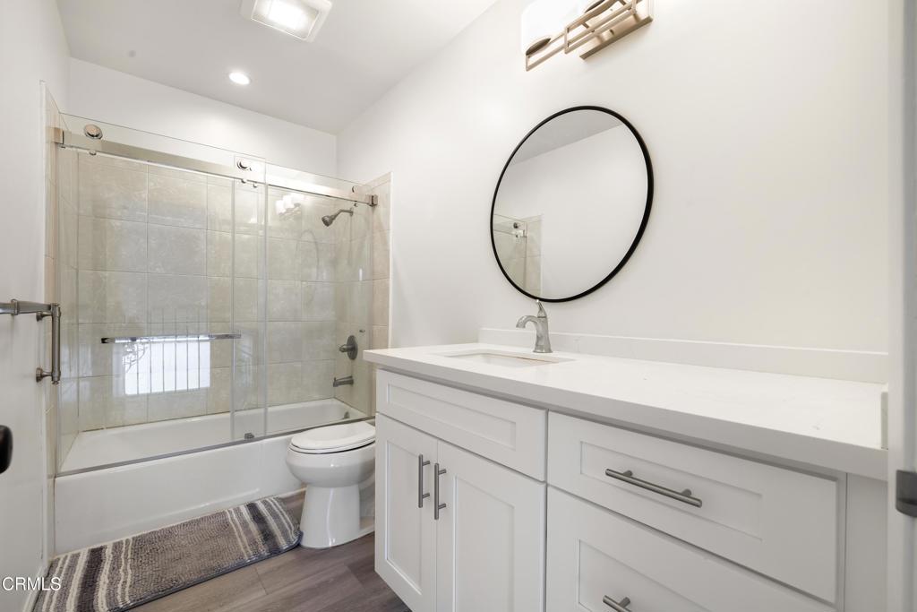 2915 Hopeton Road La Crescenta, CA 91214 - Photo 35 of 41 a bathroom with a toilet a sink and a mirror