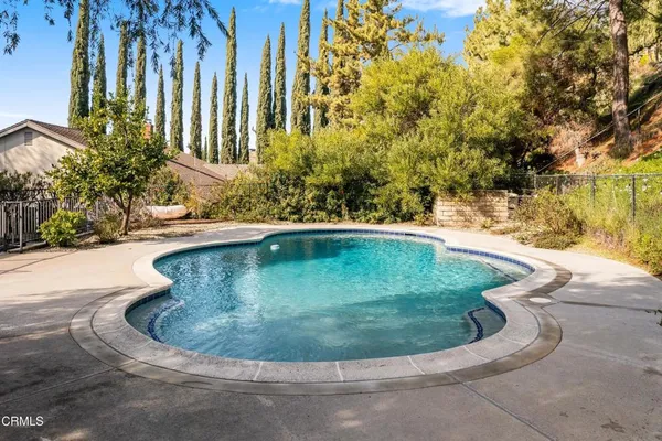 a view of a swimming pool with a sitting space