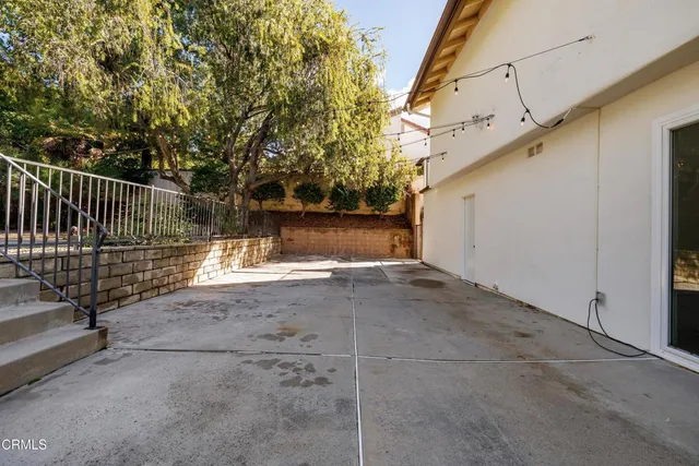 a view of backyard and small cabin