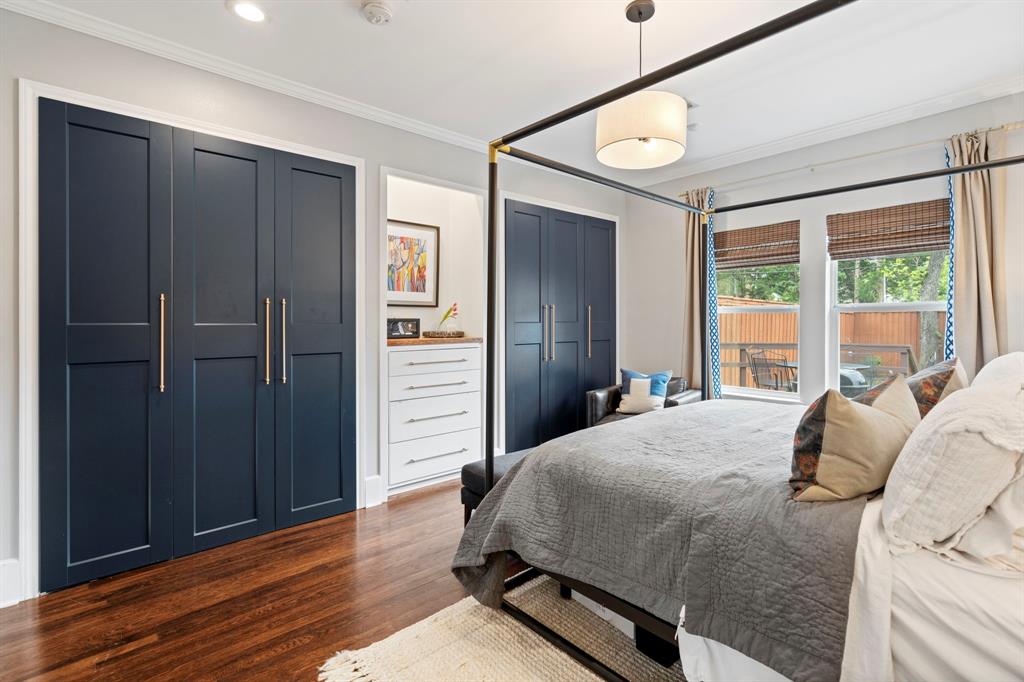 5822 Monticello Avenue Dallas, TX 75206 - Photo 15 of 24 a bedroom with a bed dresser and a large window