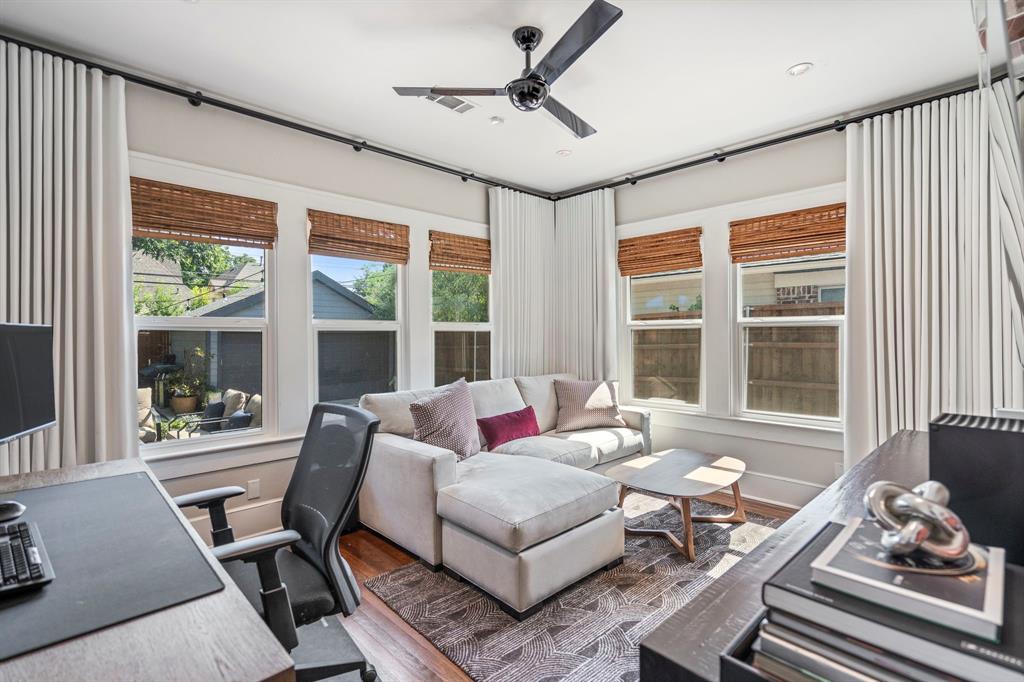 5822 Monticello Avenue Dallas, TX 75206 - Photo 20 of 24 a living room with furniture and floor to ceiling windows
