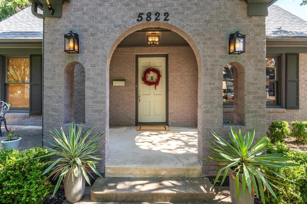 5822 Monticello Avenue Dallas, TX 75206 - Photo 3 of 24 a front view of a house with a garden