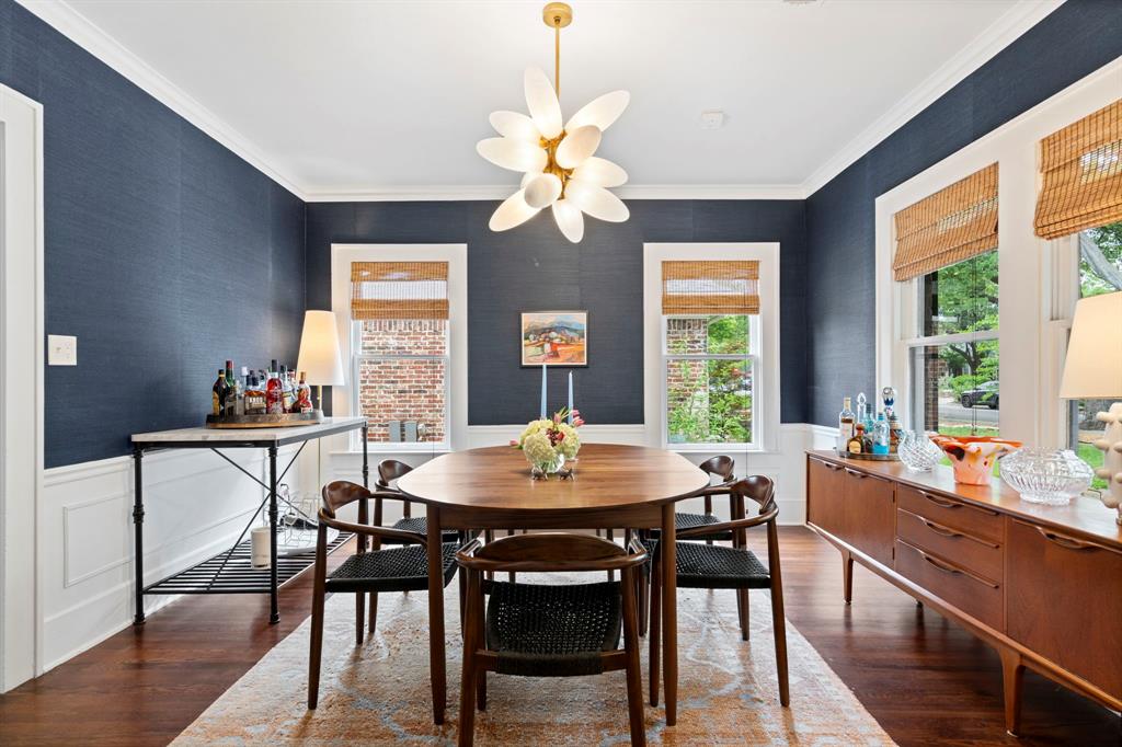 5822 Monticello Avenue Dallas, TX 75206 - Photo 7 of 24 a dining room with furniture a chandelier and wooden floor