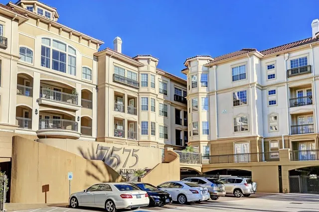 a front view of a building with parking space