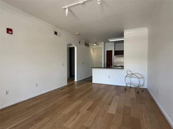 a view of a kitchen with wooden floor