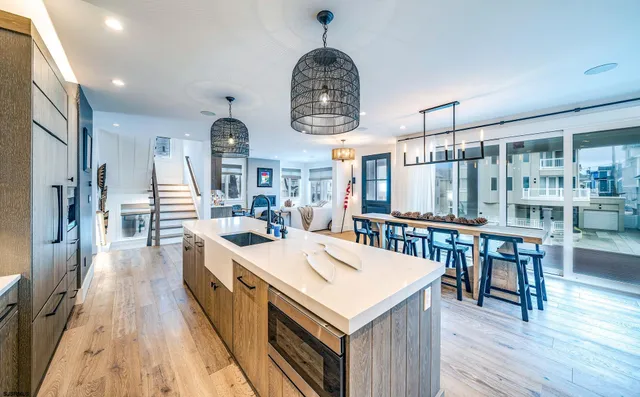 a large kitchen with a table and chairs
