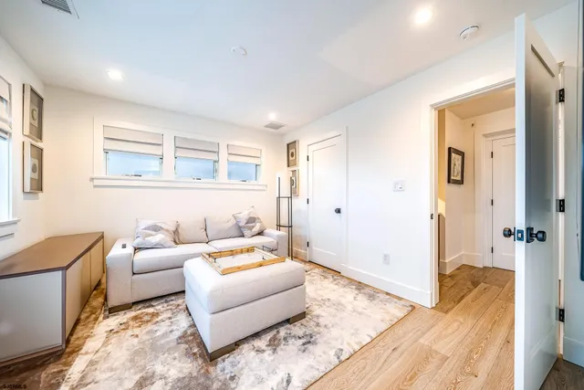 a living room with furniture and a rug