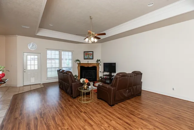 a living room with furniture and a fireplace