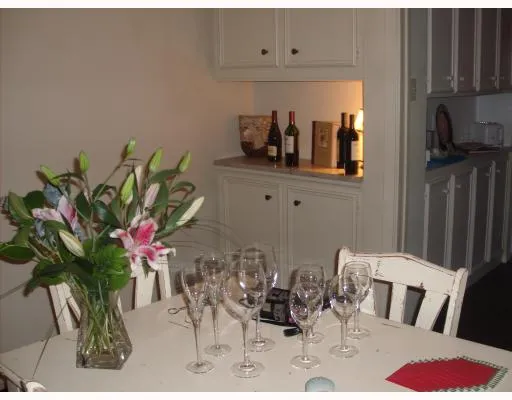 a view of living room with furniture and flowers
