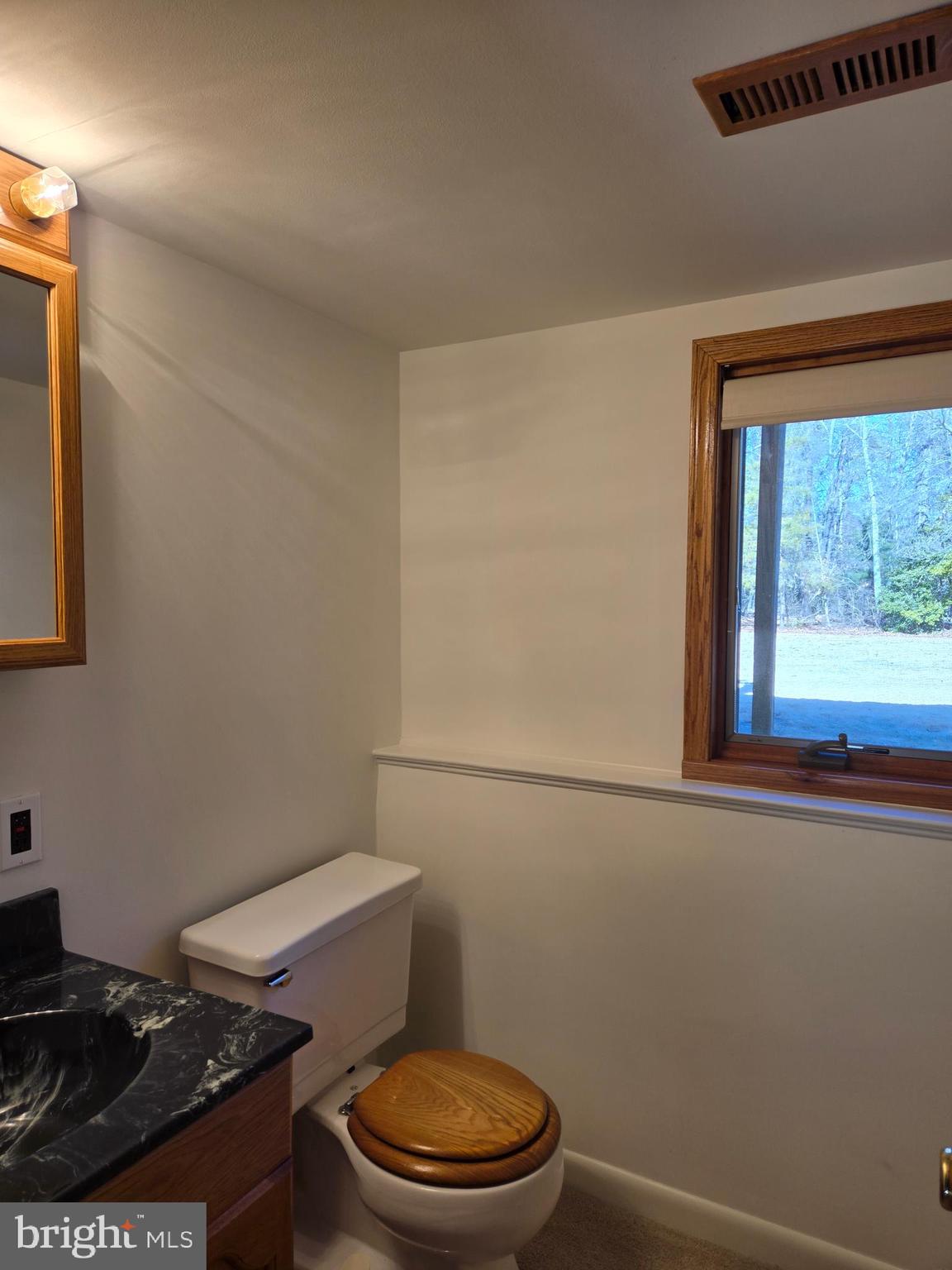 8 Sandy Drive Newfield, NJ 08344 - Photo 25 of 48 a toilet sitting in a bathroom next to a window