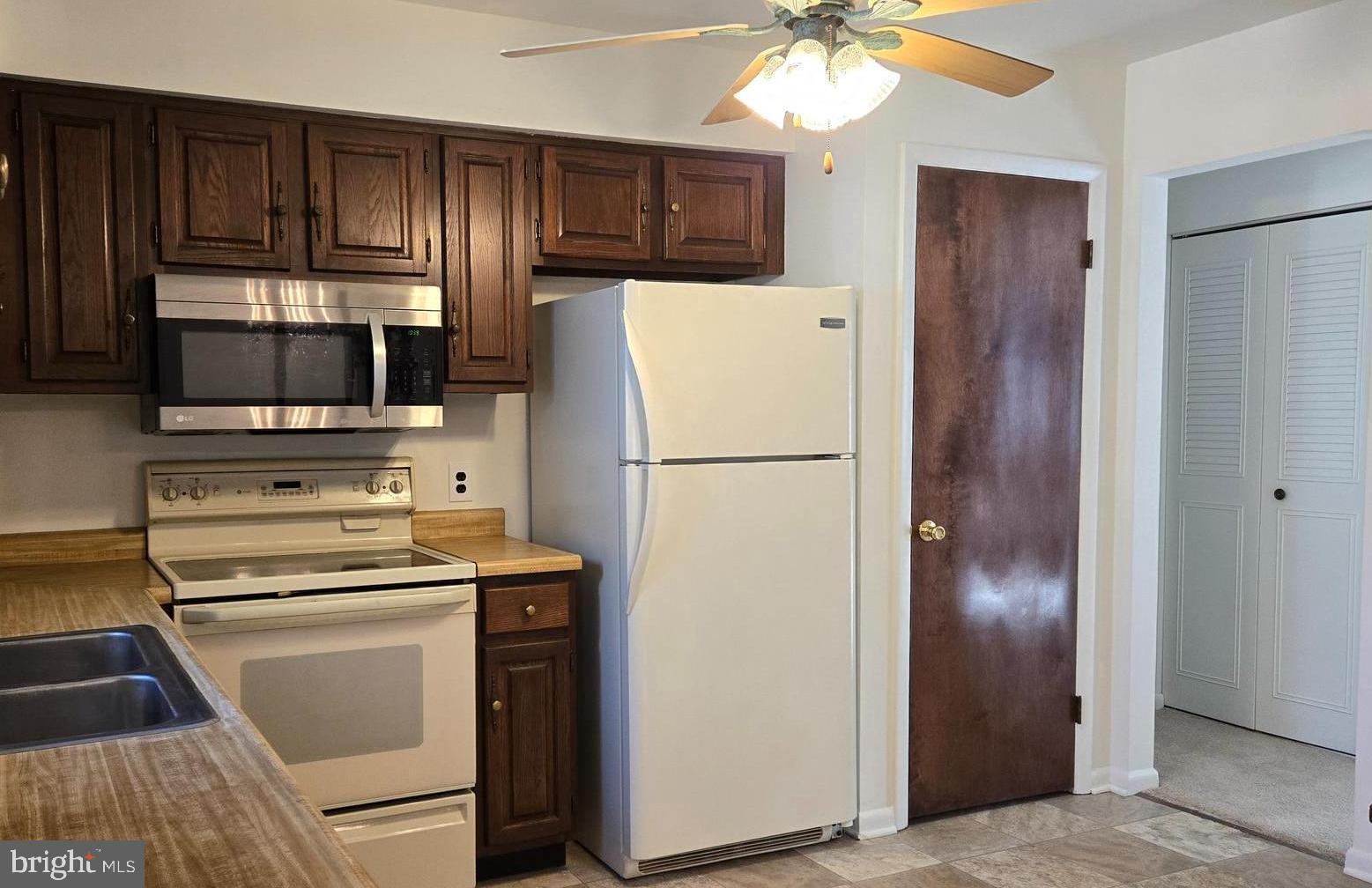8 Sandy Drive Newfield, NJ 08344 - Photo 6 of 48 a kitchen with a refrigerator sink and microwave
