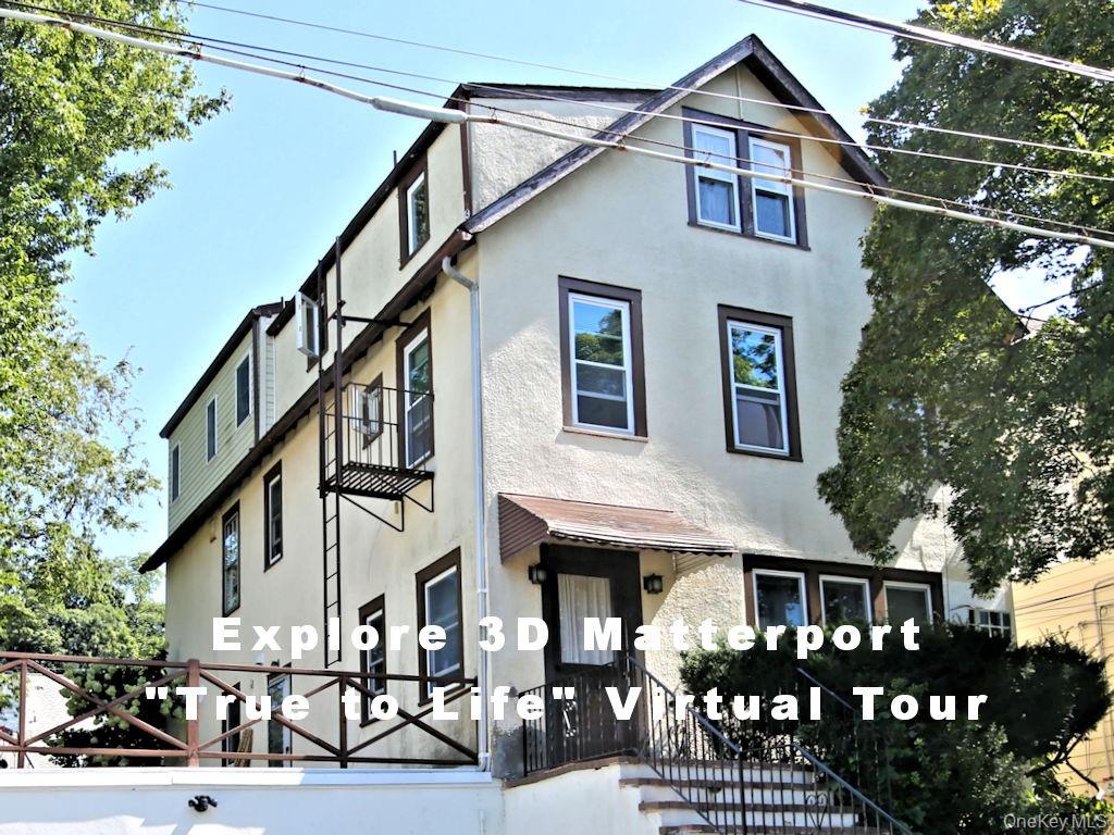56 South Lawn Avenue, Unit 3 Elmsford, NY 10523 - Photo 1 of 7 a front view of a house with entrance and yard