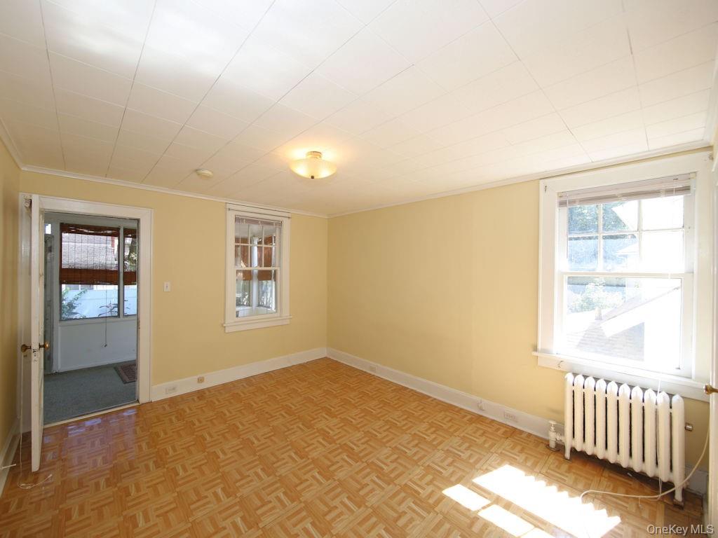 56 South Lawn Avenue, Unit 3 Elmsford, NY 10523 - Photo 3 of 7 a view of an empty room and window