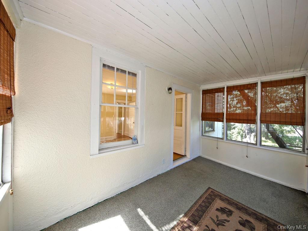 56 South Lawn Avenue, Unit 3 Elmsford, NY 10523 - Photo 5 of 7 a view of an empty room with a window