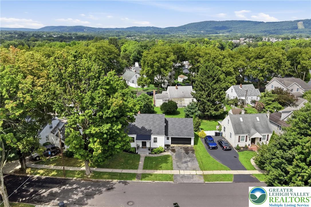 408 Maple Road Hellertown, PA 18055 - Photo 61 of 66 Lush mature trees surround this classic suburban home with a backdrop of rolling hills.