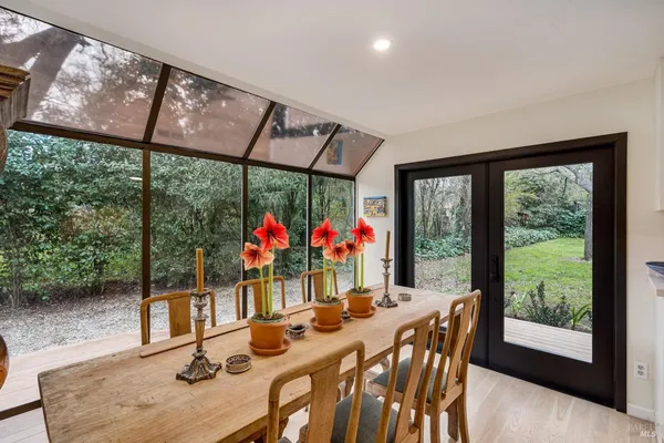 a view of a dining room with furniture window and outside view