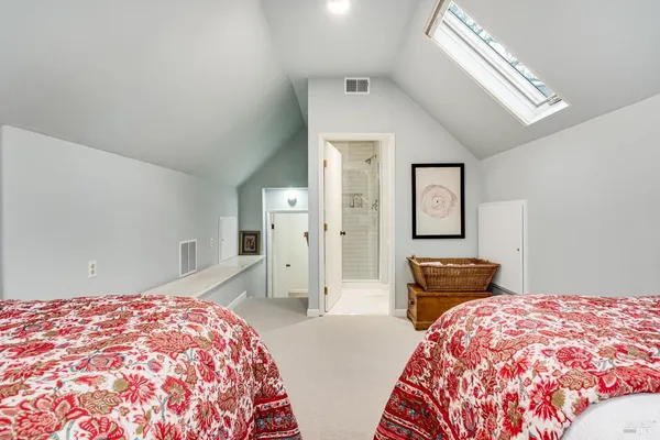 a bedroom with bed and window