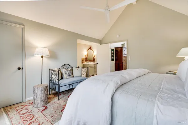 a bedroom with bed and a lamp