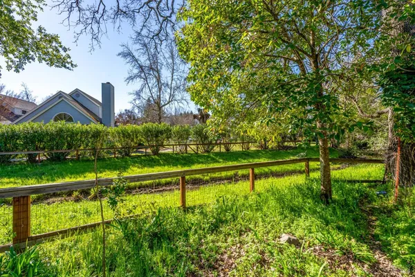 a view of lake with a yard