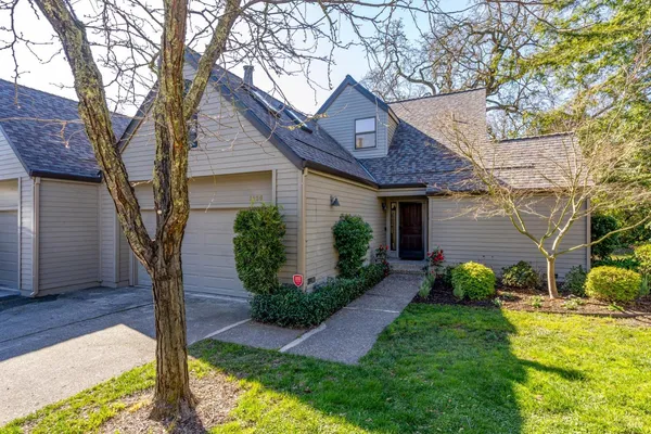 a front view of a house with garden