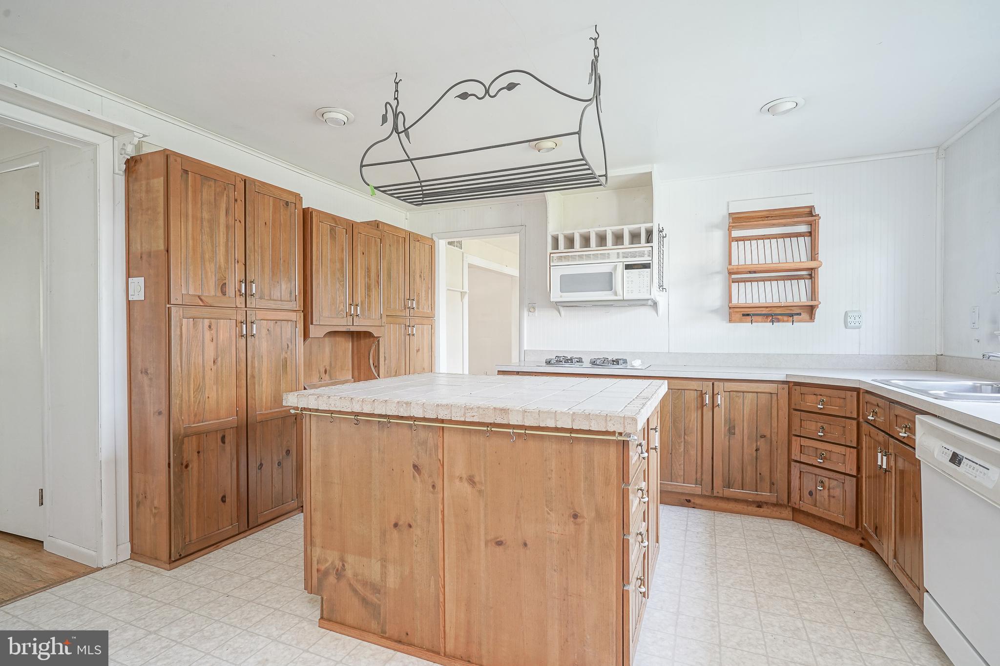 152 Kelly Driver Road Laurel Springs, NJ 08021 - Photo 10 of 30 a kitchen with kitchen island a stove a sink and a refrigerator