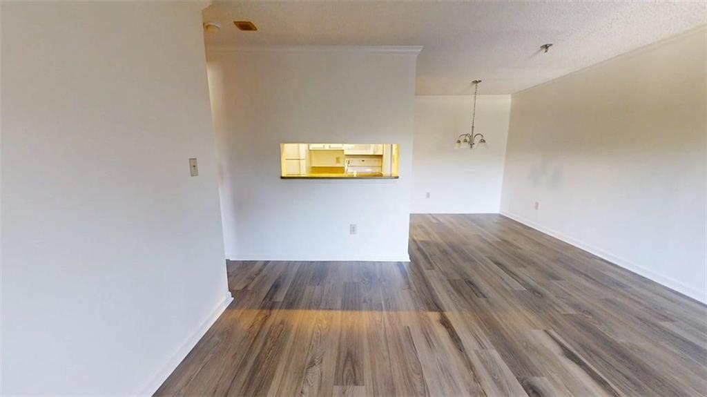 300 Johnson Ferry Road, Unit B409 Atlanta, GA 30328 - Photo 12 of 40 a view of kitchen space with wooden floor
