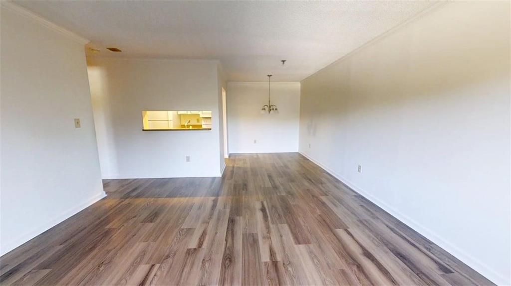 300 Johnson Ferry Road, Unit B409 Atlanta, GA 30328 - Photo 13 of 40 a view of empty room with wooden floor