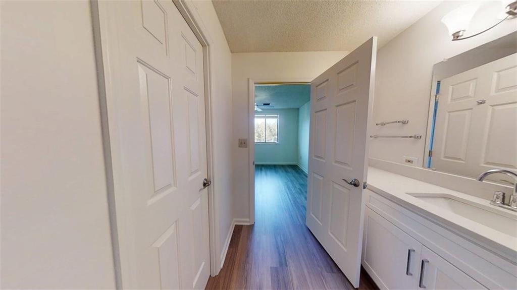 300 Johnson Ferry Road, Unit B409 Atlanta, GA 30328 - Photo 22 of 40 a bathroom with a sink and a mirror