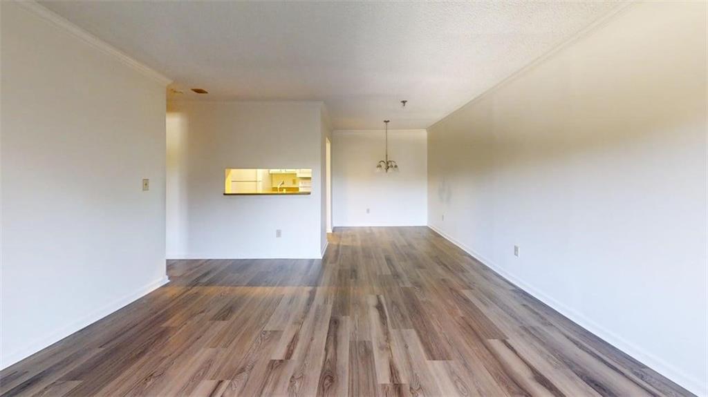 300 Johnson Ferry Road, Unit B409 Atlanta, GA 30328 - Photo 30 of 40 a view of empty room with wooden floor