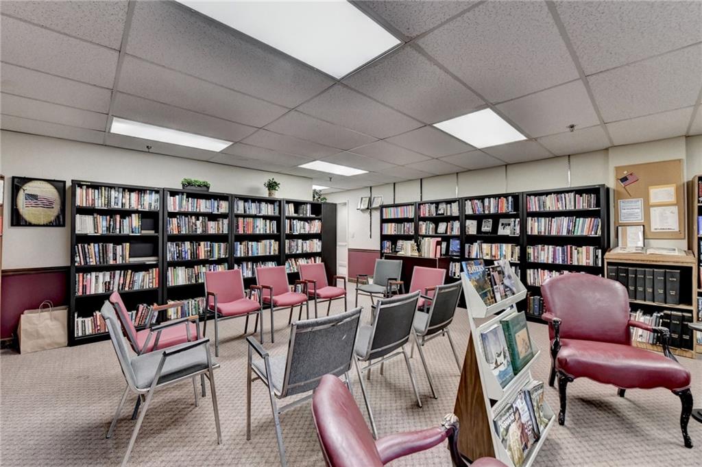 300 Johnson Ferry Road, Unit B409 Atlanta, GA 30328 - Photo 35 of 40 a work room with furniture and book shelf
