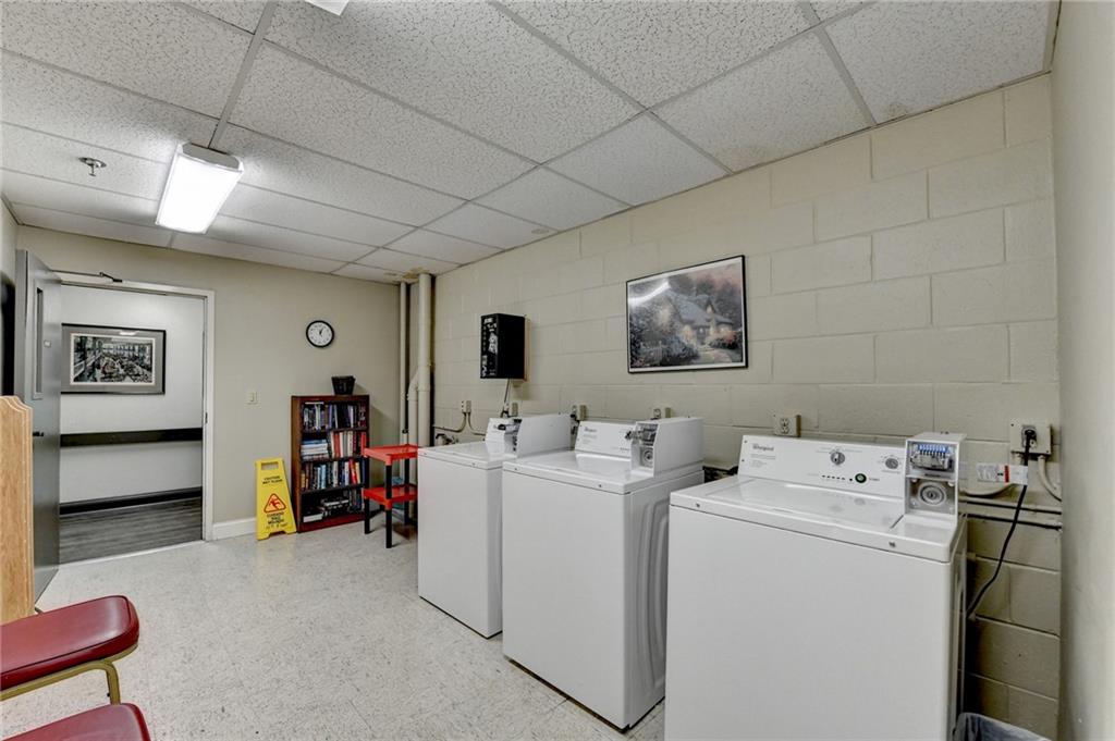 300 Johnson Ferry Road, Unit B409 Atlanta, GA 30328 - Photo 40 of 40 a view of storage and utility room with washer and dryer