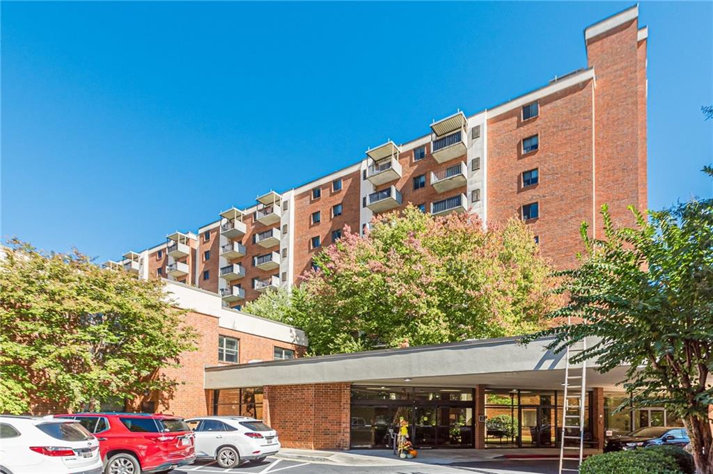 300 Johnson Ferry Road, Unit B409 Atlanta, GA 30328 - Photo 4 of 40 a front view of a building with trees