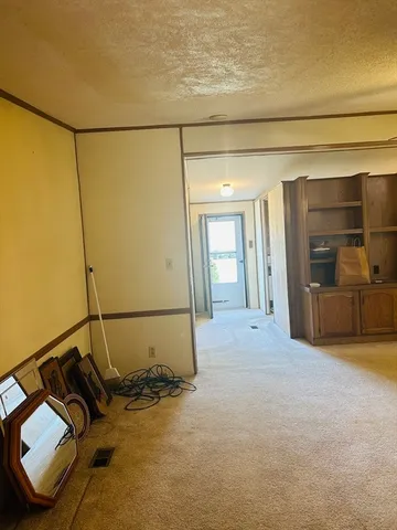 a white toilet sitting next to a bathtub