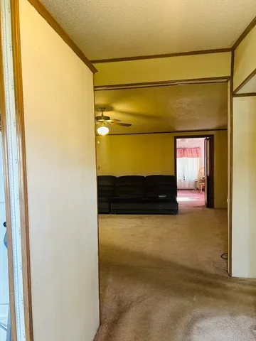 a view of entryway with a small yard