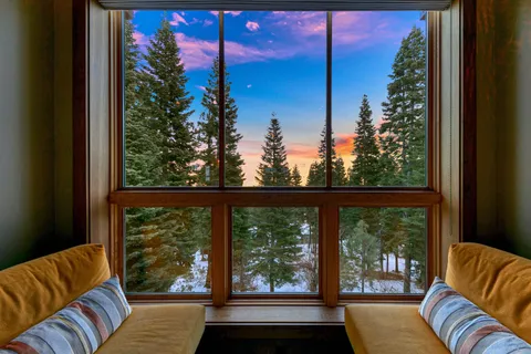 a spacious bathroom with a double vanity sink a mirror and a bathtub